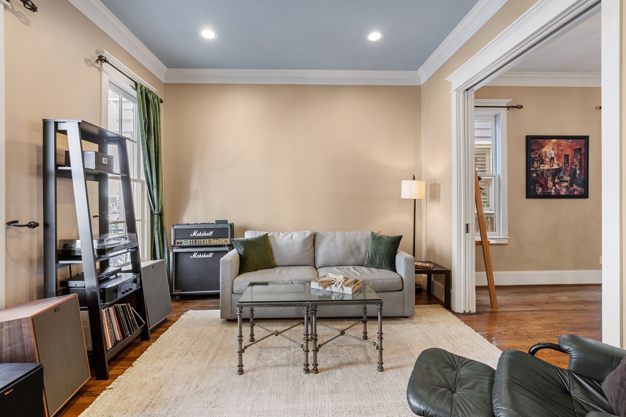 316 Aurora Street Houston, TX 77008 - Photo 12 of 31 The formal living room is positioned just off of the entry and features pocket doors that allow the space to remain open or be closed off for added privacy, offering flexibility for use as a sitting room, home office, or additional living area.
