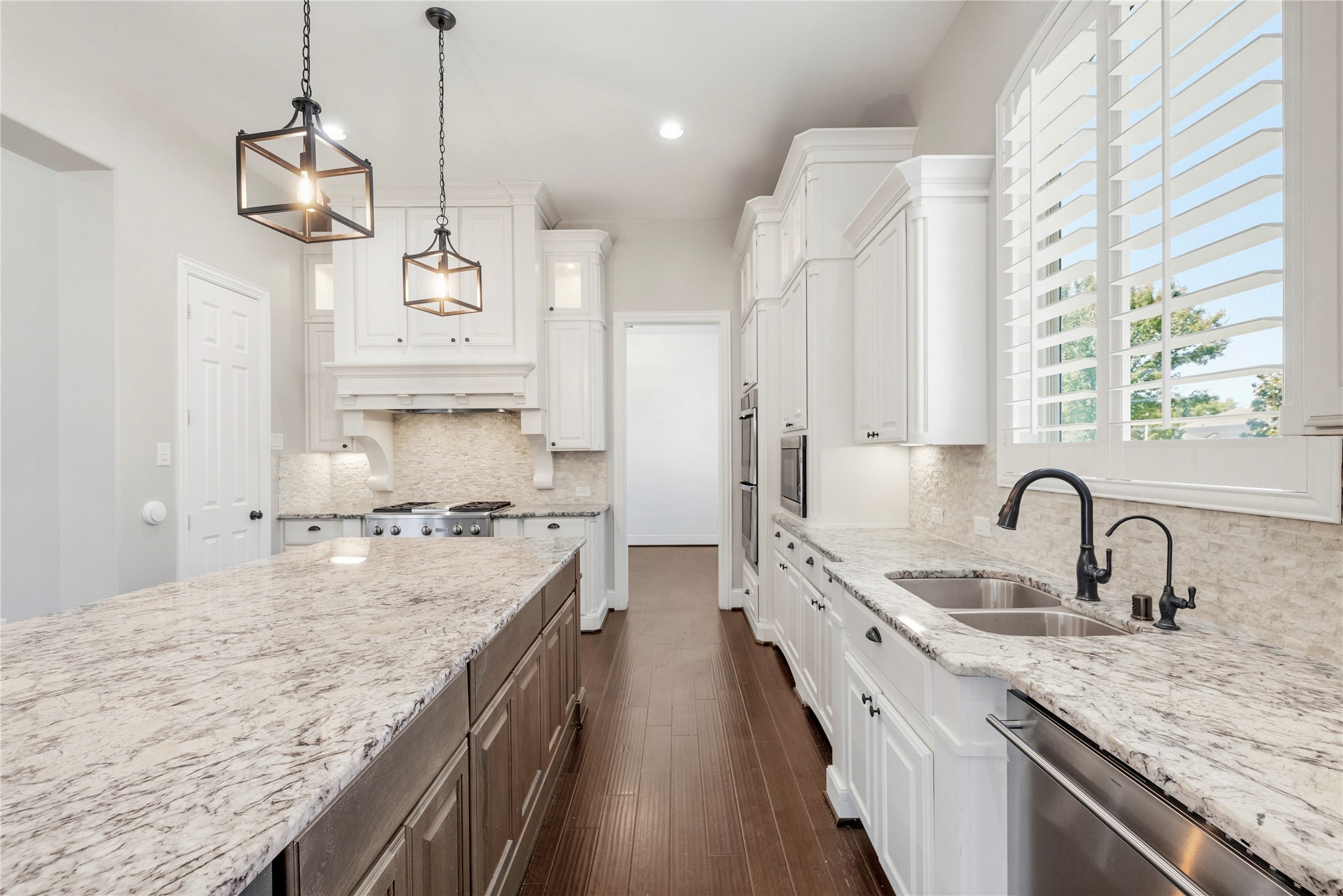 28226 South Firethorne Road Katy, TX 77494 - Photo 10 of 39 The open-concept design is perfected by custom soft-closing cabinetry, double ovens, and a professional-grade gas cooktop.