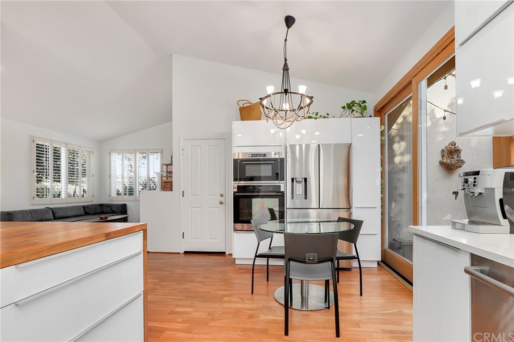 15 Marsala Irvine, CA 92606 - Photo 5 of 31 a view of a dining room and livingroom with furniture wooden floor a chandelier