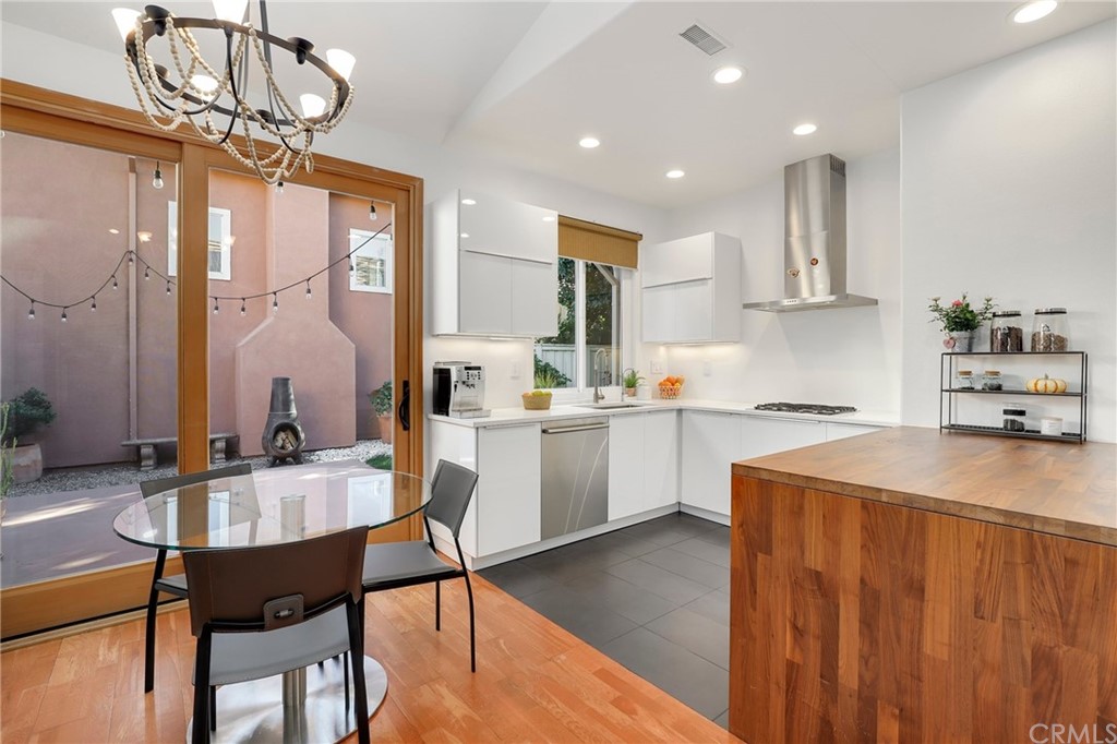 15 Marsala Irvine, CA 92606 - Photo 9 of 31 a kitchen with a table chairs stove and cabinets