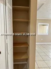 a stove top oven sitting inside of a kitchen