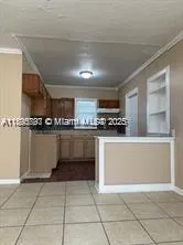 a kitchen with stainless steel appliances a refrigerator sink and cabinets