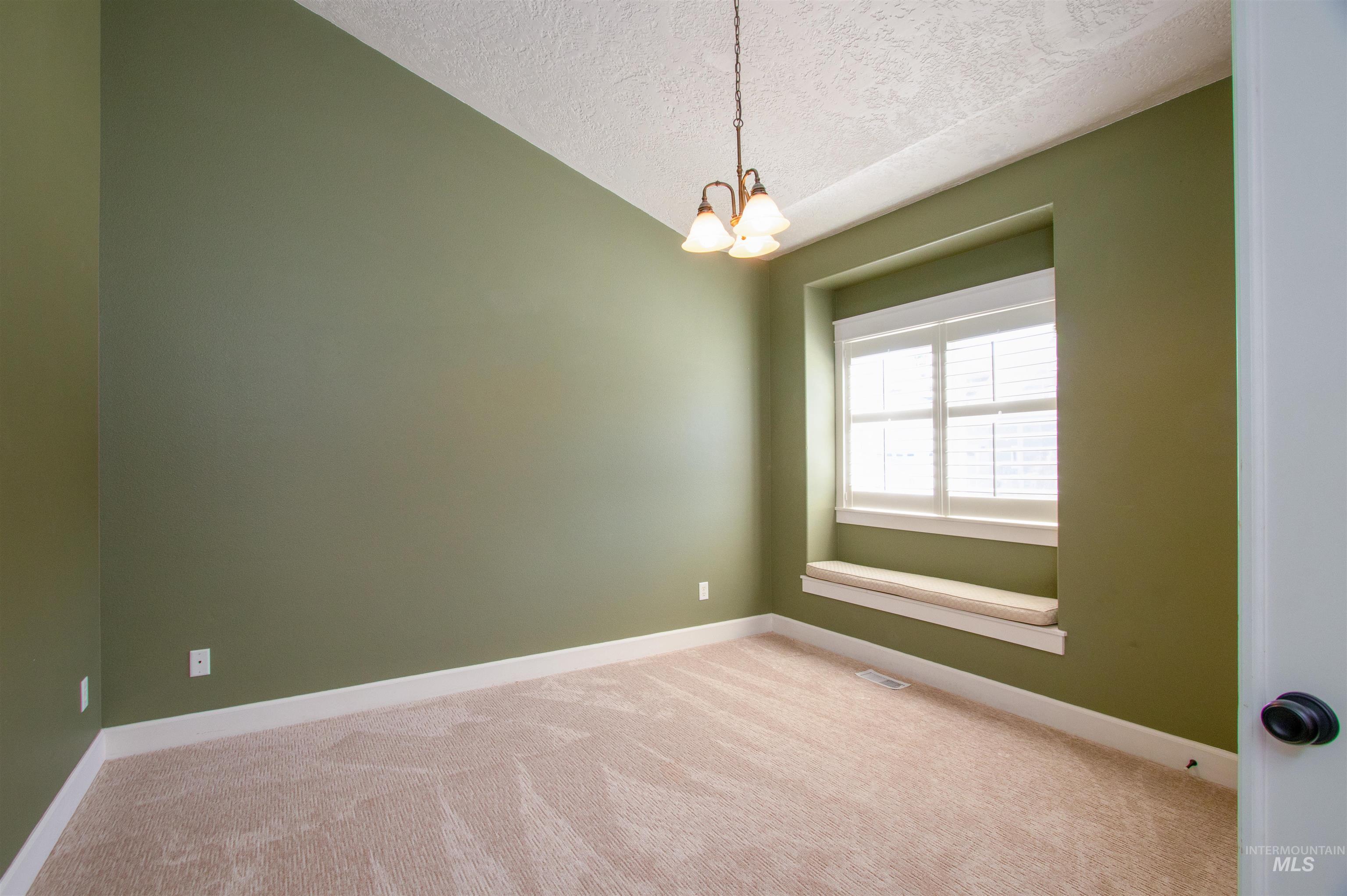 892 South Capitola Way Boise, ID 83712 - Photo 5 of 34 Recessed window with plantation shutters and a built-in window seat