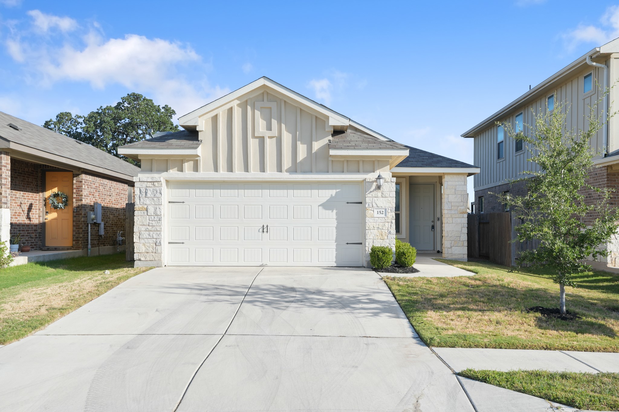 152 Mountain Valley Street Georgetown, TX 78628 - Photo 37 of 38 Board and batten siding pairs with stone accents to create classic curb appeal.