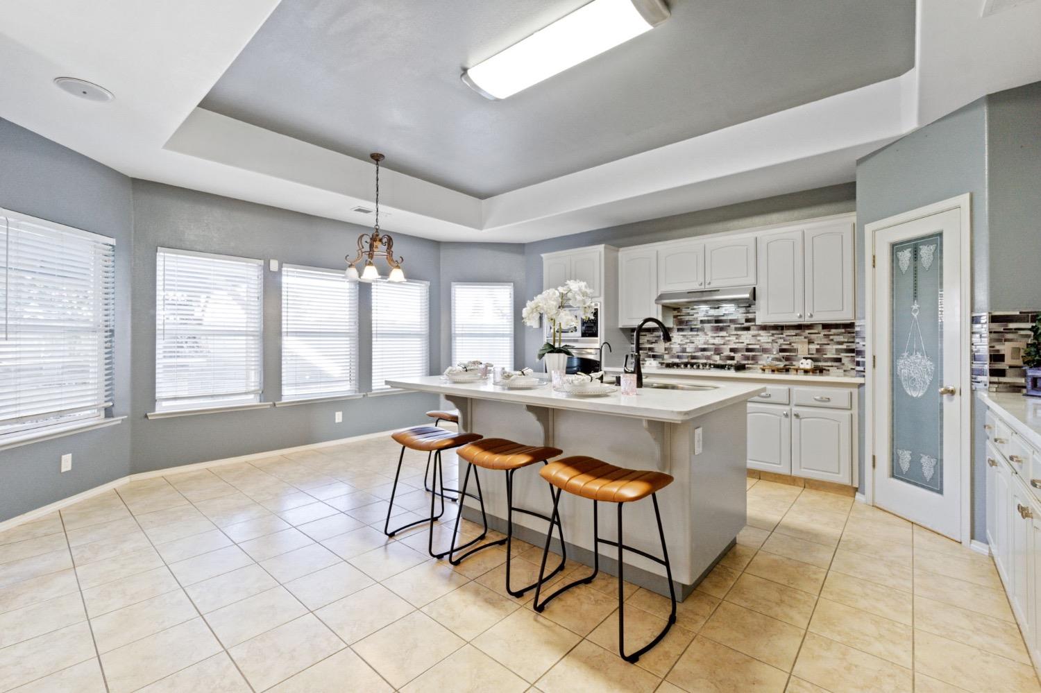 3089 Express Court Madera, CA 93637 - Photo 11 of 39 a kitchen with a sink cabinets and window