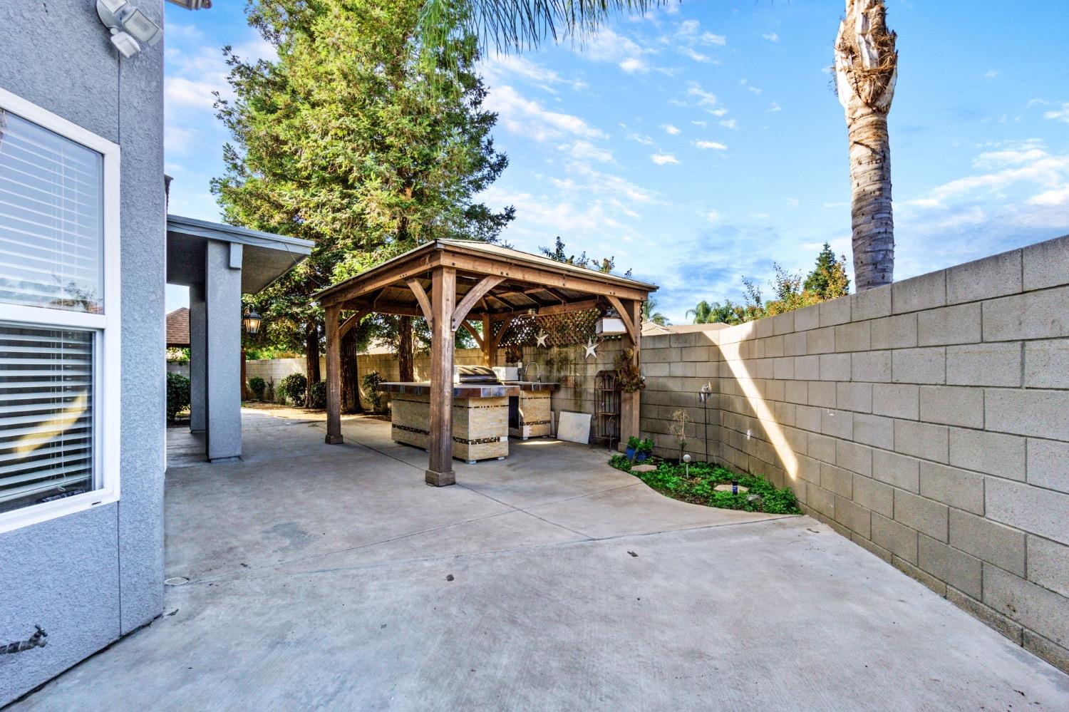 3089 Express Court Madera, CA 93637 - Photo 28 of 39 a view of a house with a yard
