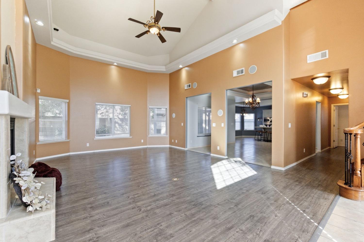 3089 Express Court Madera, CA 93637 - Photo 4 of 39 a view of livingroom with hardwood floor and a kitchen