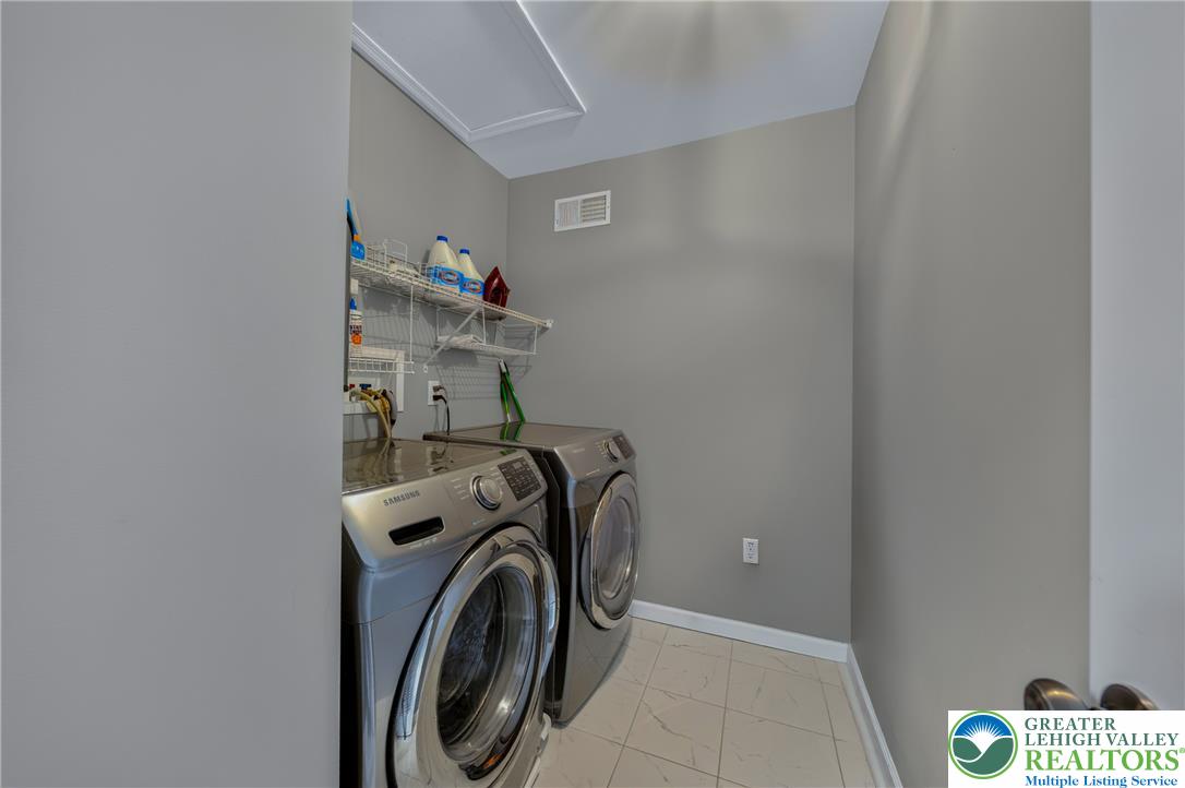 4236 Creek Road Allentown, PA 18104 - Photo 29 of 47 Tiled floors and built-in wire shelving maximize utility in this functional laundry space.