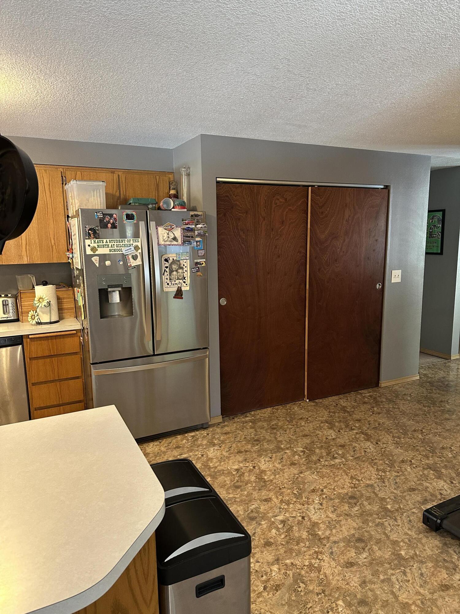 123977 Surveyor Road Crescent Lake, OR 97733 - Photo 22 of 41 a kitchen with a refrigerator and a stove