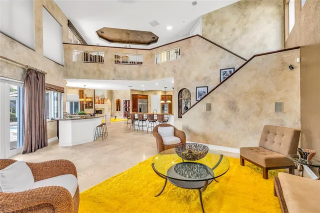 a view of a swimming pool with outdoor seating