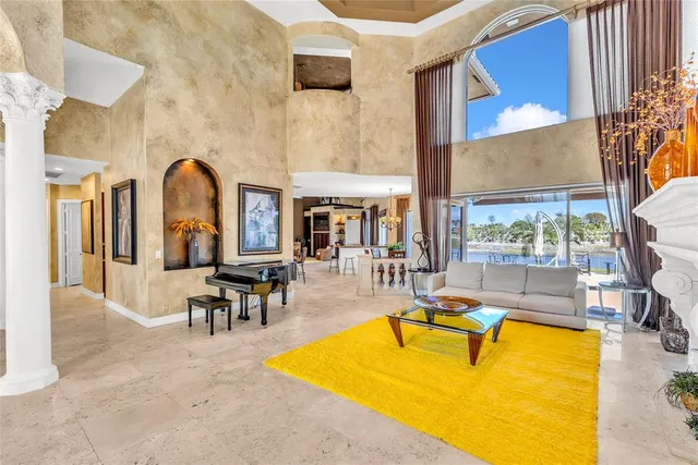 a living room with furniture cabinets and a window