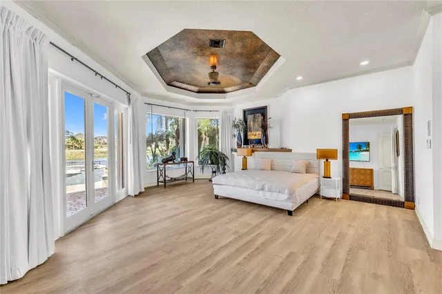 a spacious en suite bathroom with a granite countertop tub and a large mirror