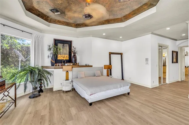 a spacious bathroom with a granite countertop sink and a mirror