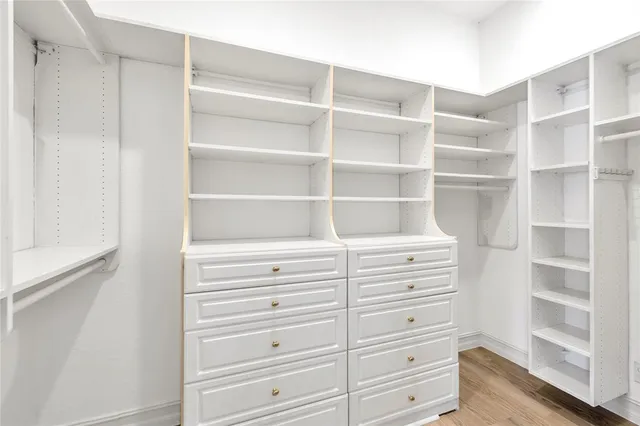 a living room with a bed and a chandelier