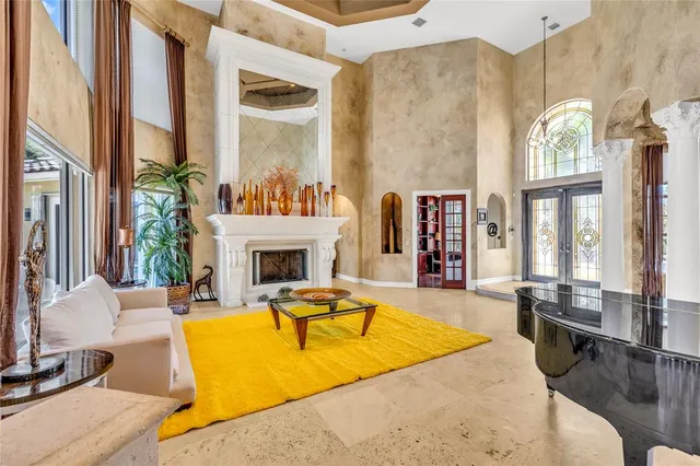 a living room with fireplace furniture and a fireplace