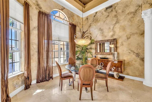 a view of a livingroom with furniture and a window