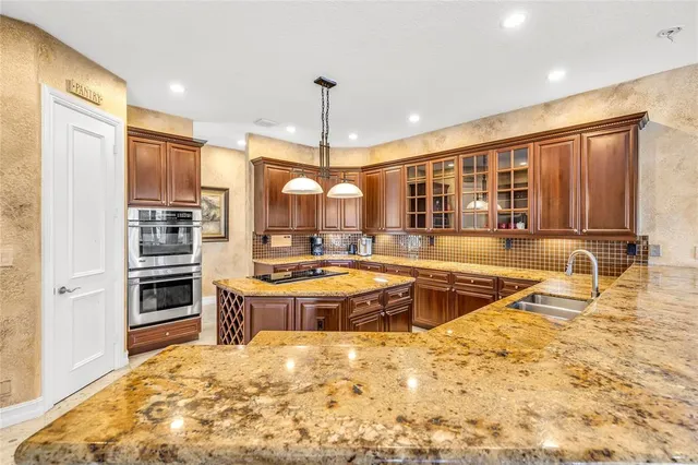 a large swimming pool with a large window and kitchen view