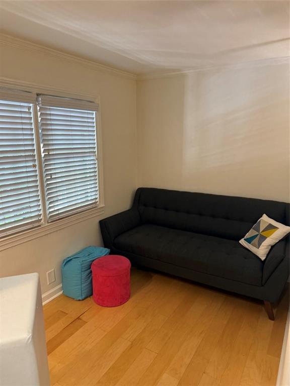 655 East Campus Road, Unit 33 Athens, GA 30605 - Photo 7 of 13 a living room with a couch and a window
