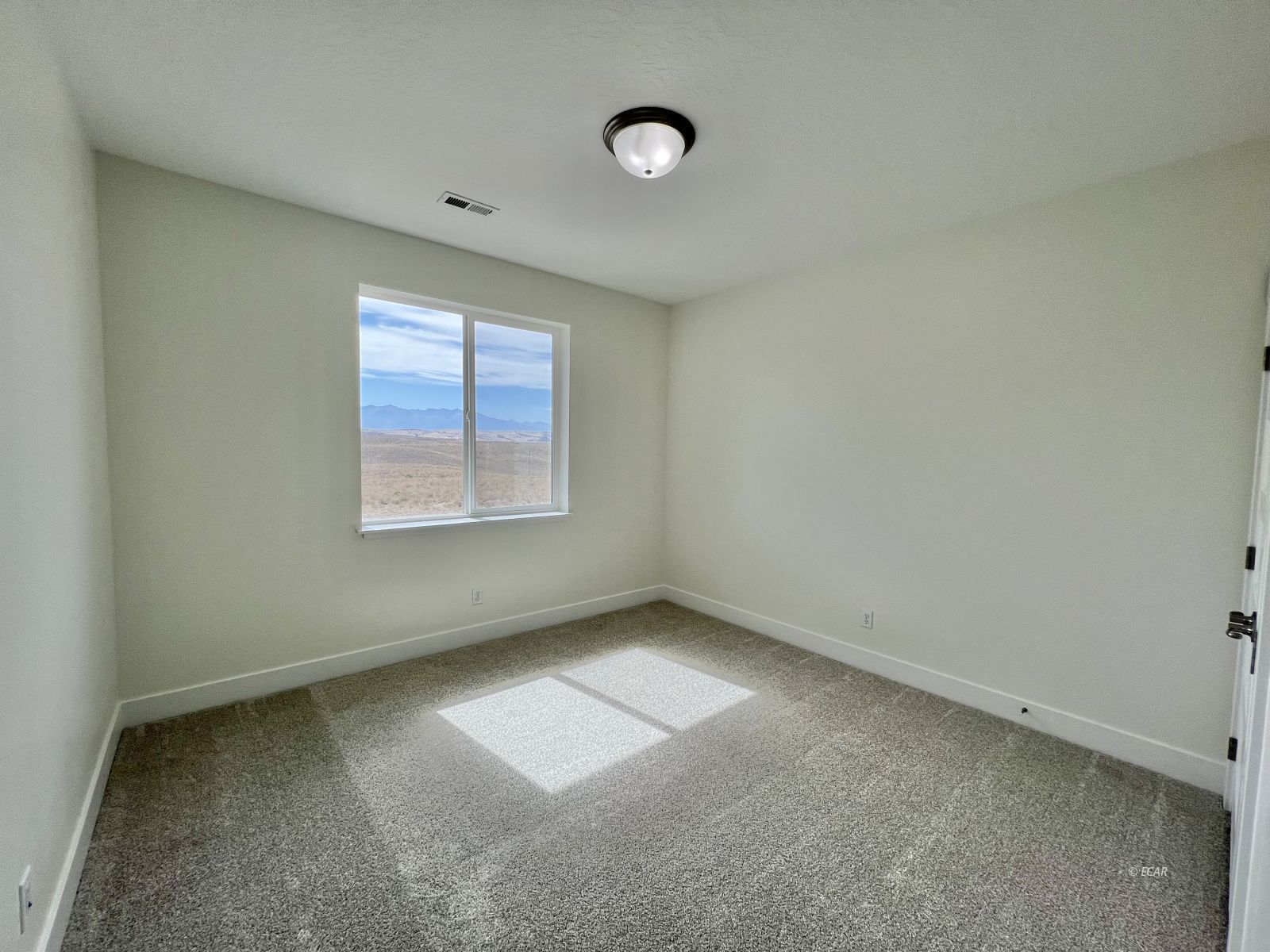 142 Diamond Rdg Drive Spring Creek, NV 89815 - Photo 19 of 36 an empty room with windows and entrance