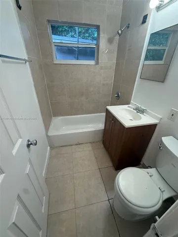 a bathroom with a sink a toilet and a bathtub