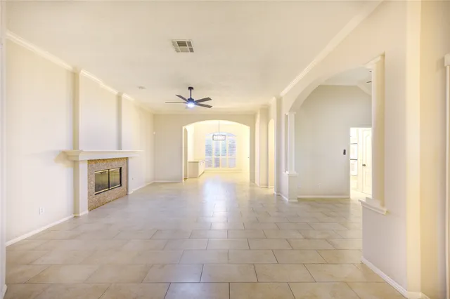 a view of an empty room with a fireplace