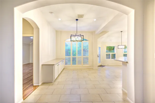 a view of a livingroom with a ceiling fan and window