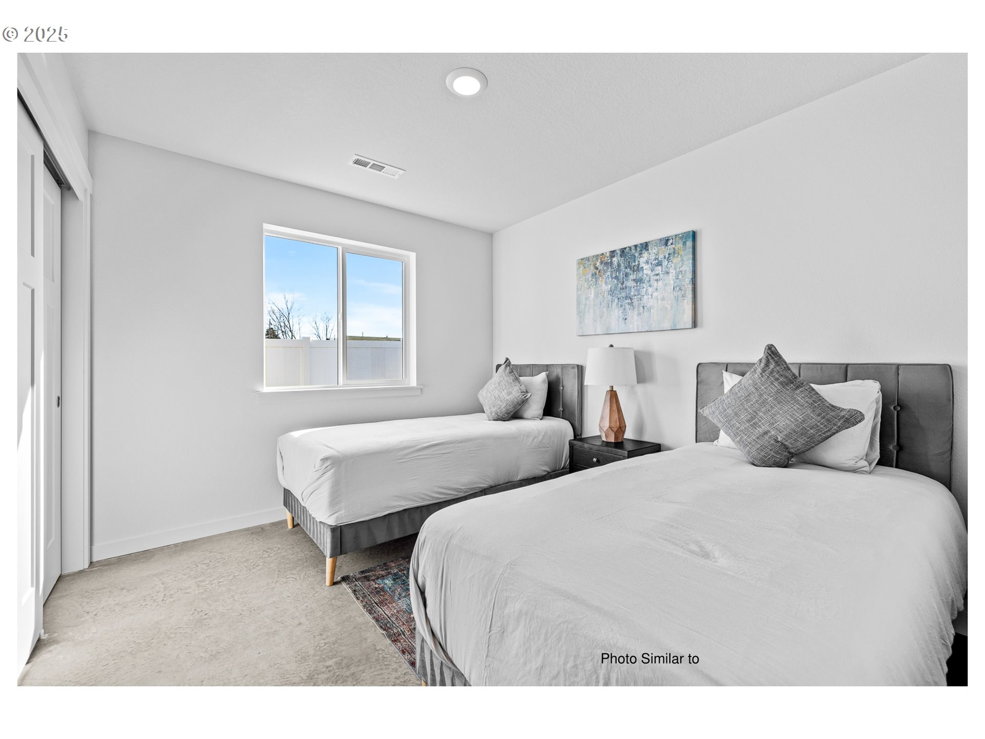 670 Jimmy Street Stanfield, OR 97875 - Photo 5 of 11 a bedroom with two beds and a window