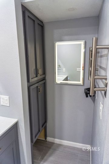 316 Mesquite Avenue Ridgecrest, CA 93555 - Photo 23 of 38 a view of a small space with wooden floor and a window
