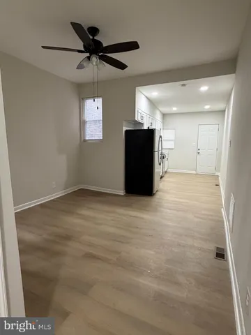 a kitchen with stainless steel appliances a refrigerator and a sink