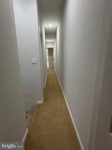 a view of hallway with stairs