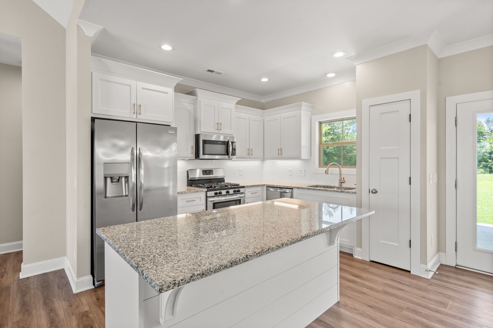 6580 Murfreesboro Road Lebanon, TN 37090 - Photo 8 of 33 a kitchen with granite countertop a center island and stainless steel appliances
