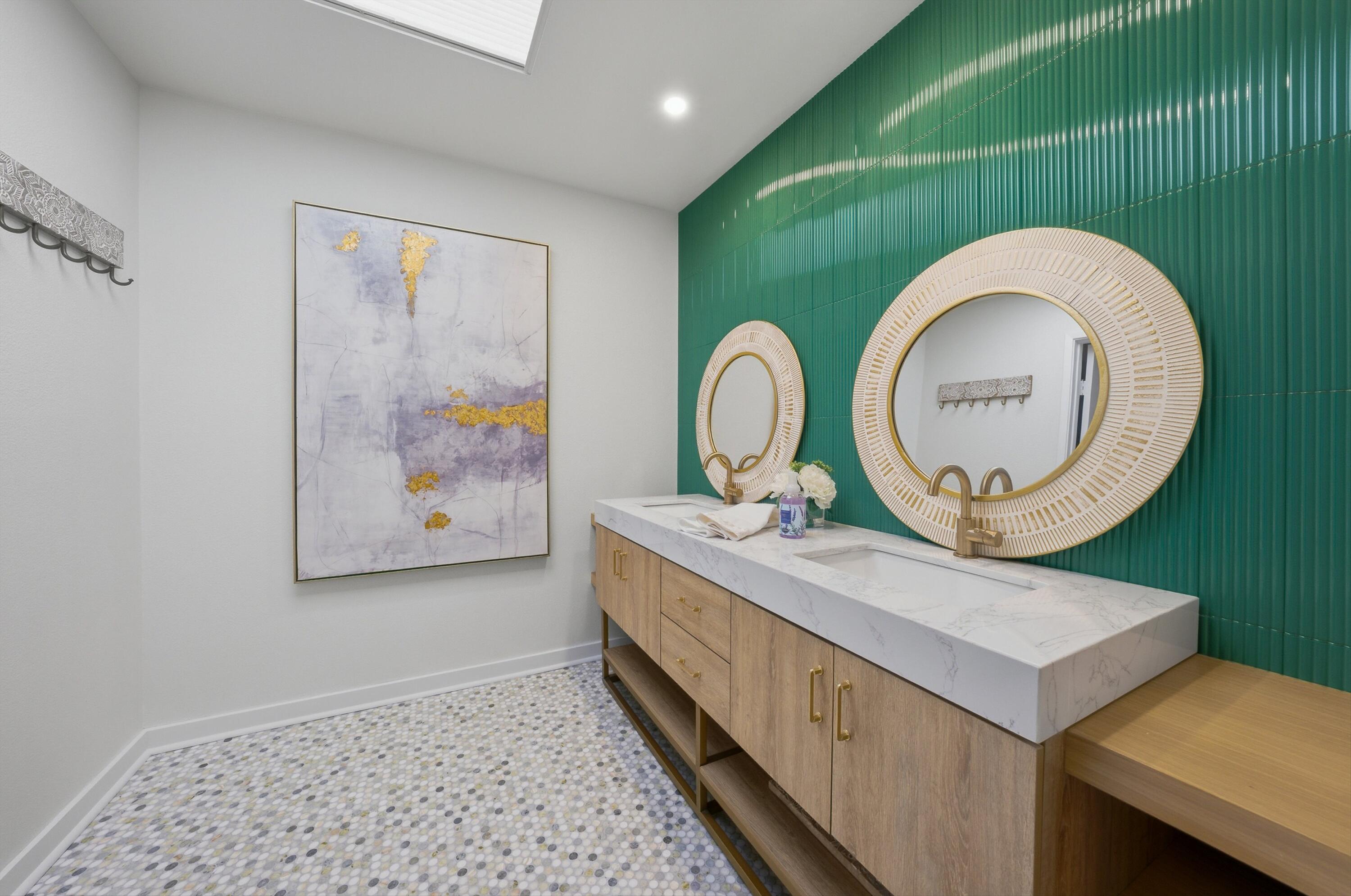 23 Leon Way Rancho Mirage, CA 92270 - Photo 21 of 32 a bathroom with a double vanity sink and a mirror