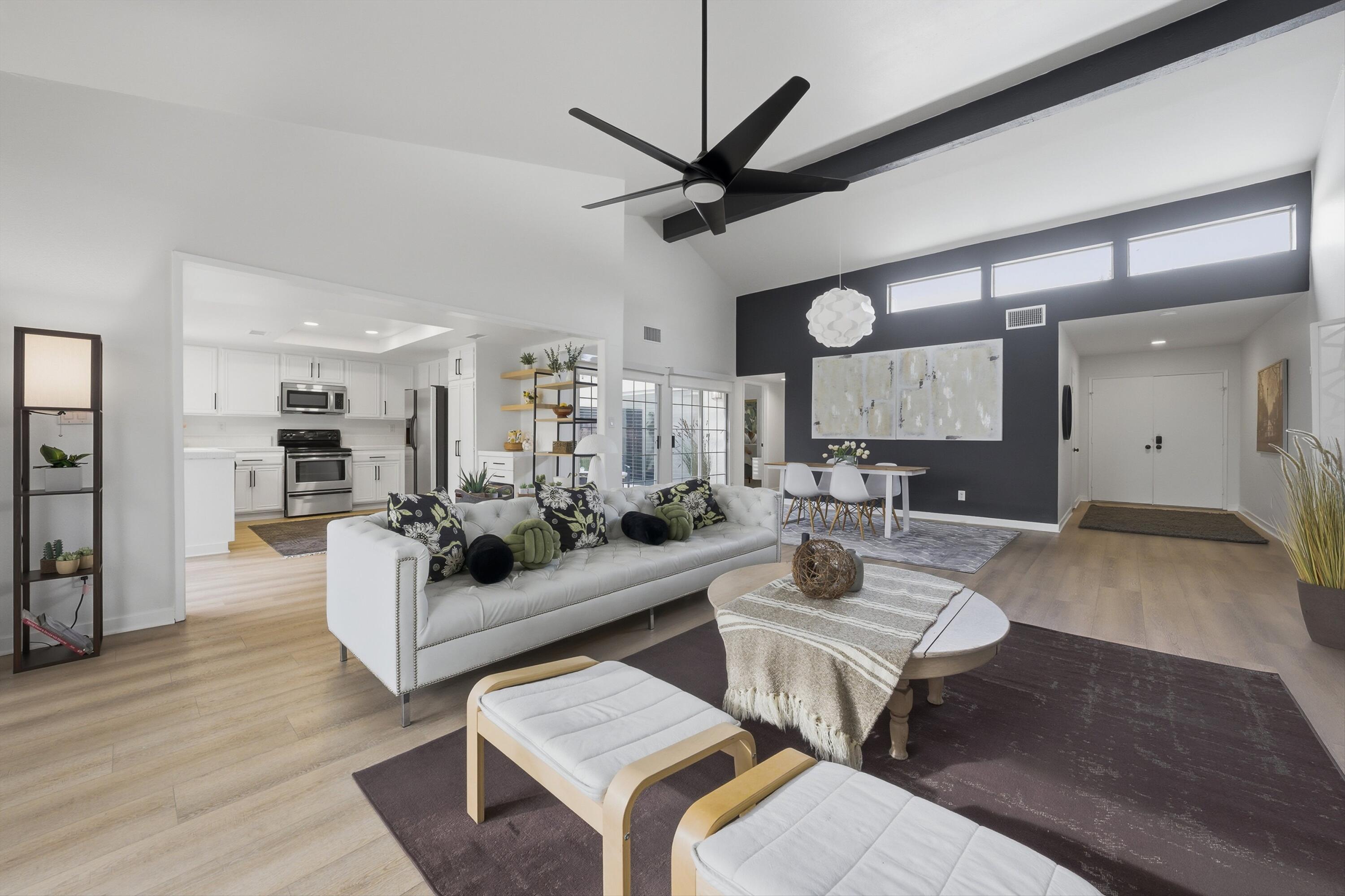 23 Leon Way Rancho Mirage, CA 92270 - Photo 6 of 32 a living room with lots of furniture and a wooden floor