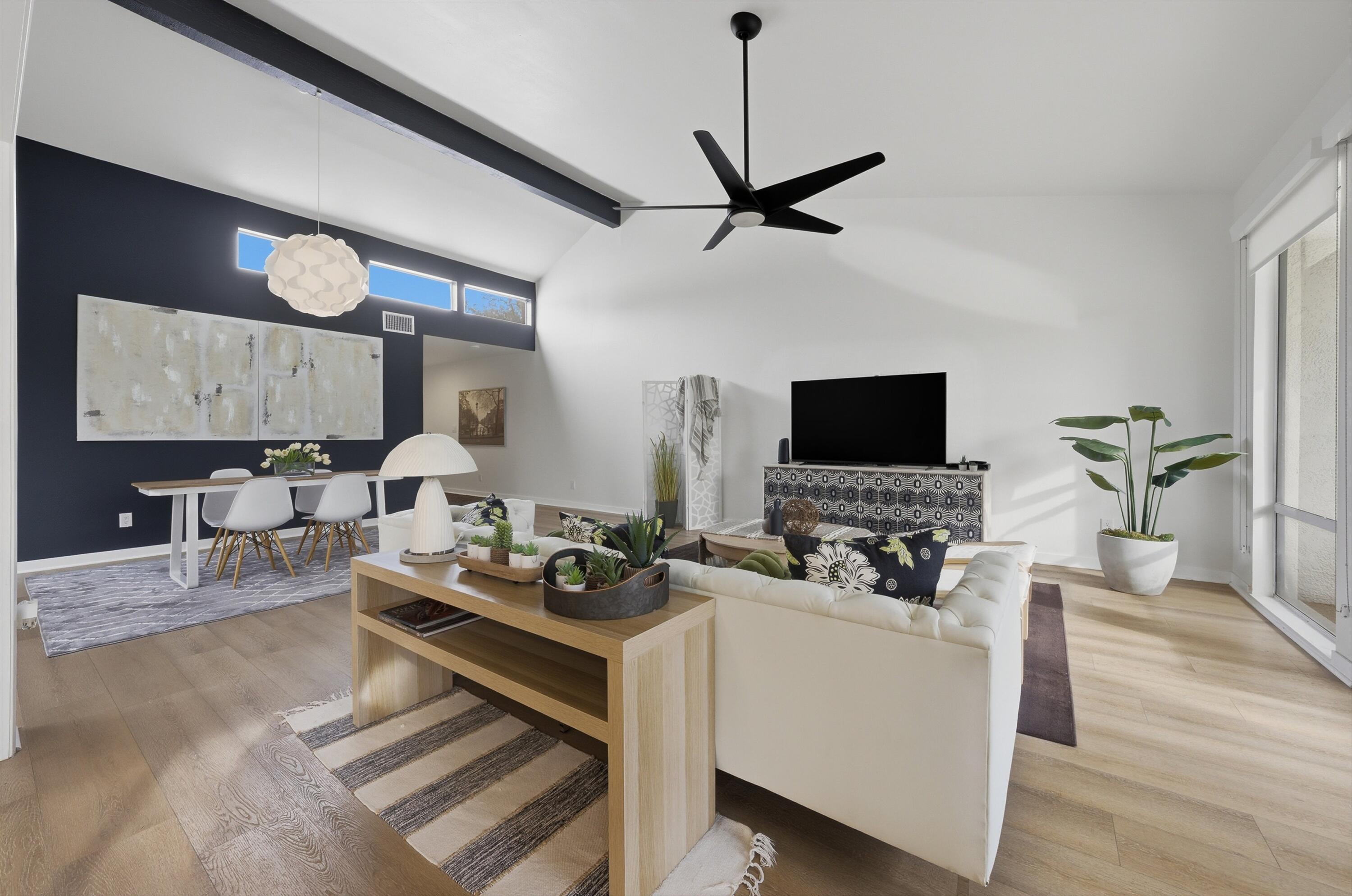 23 Leon Way Rancho Mirage, CA 92270 - Photo 7 of 32 a living room with furniture and a flat screen tv