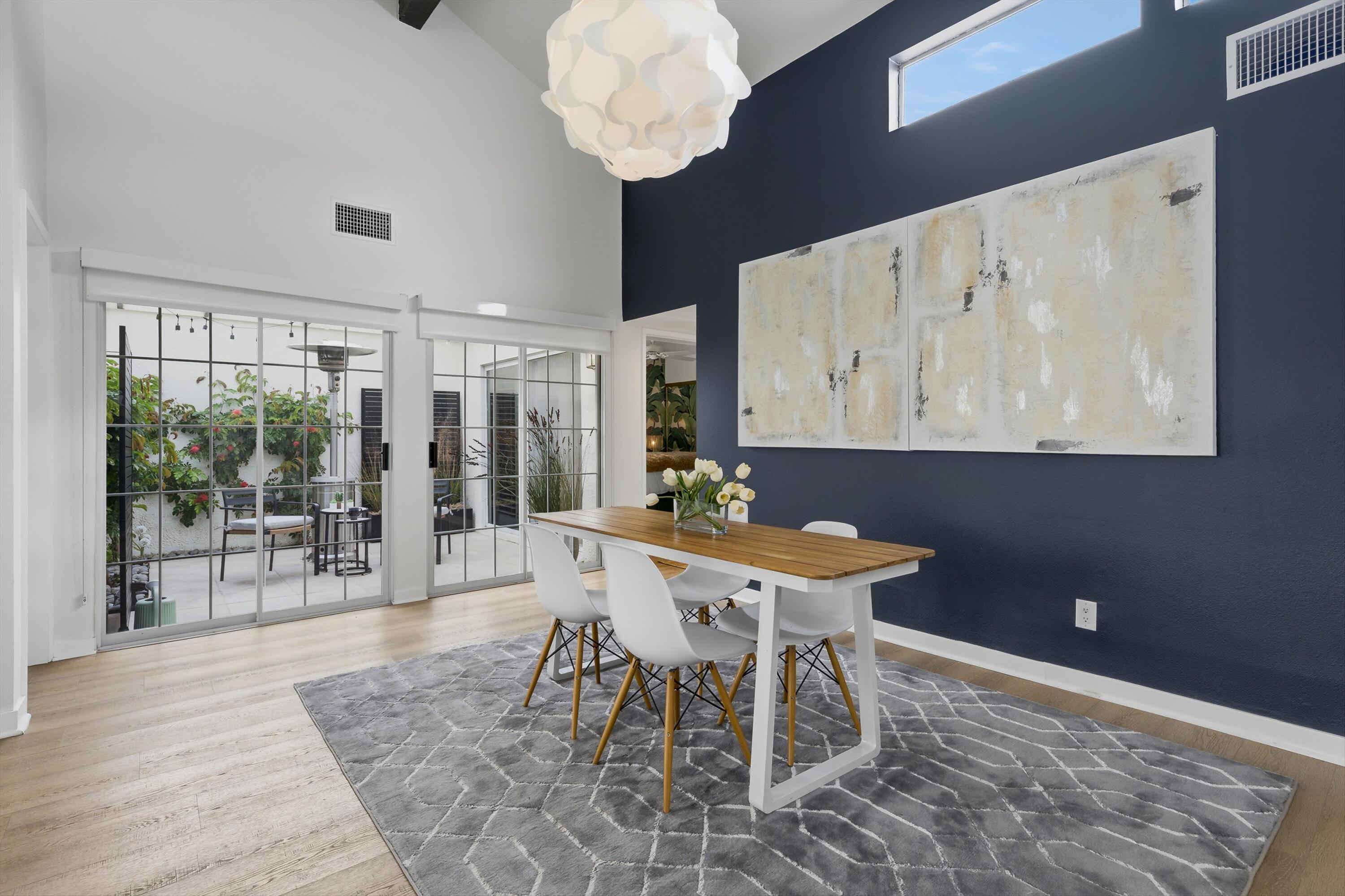 23 Leon Way Rancho Mirage, CA 92270 - Photo 8 of 32 a view of a dining room with furniture wooden floor and chandelier