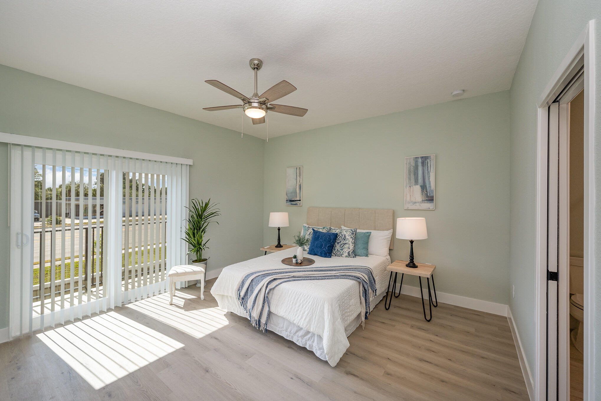 900 Paddleboard Court Melbourne, FL 32935 - Photo 12 of 32 a bedroom with a large bed and a window