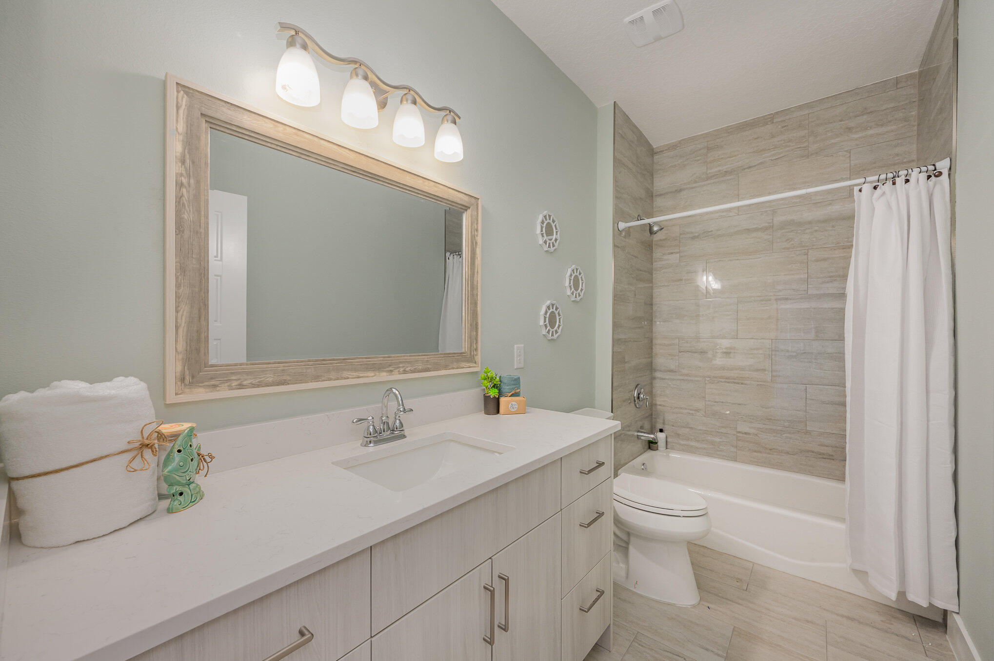 900 Paddleboard Court Melbourne, FL 32935 - Photo 19 of 32 a bathroom with a sink a toilet and shower