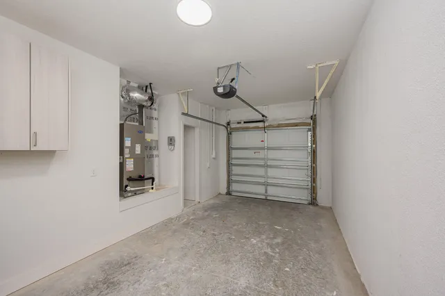 a view of an empty room with a white walls