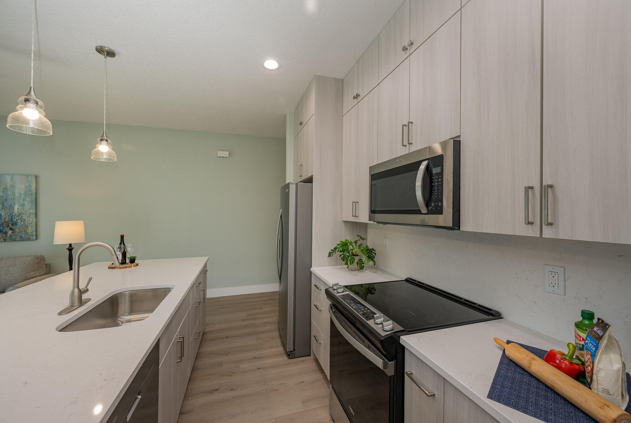 900 Paddleboard Court Melbourne, FL 32935 - Photo 9 of 32 a kitchen that has a sink and a stove in it