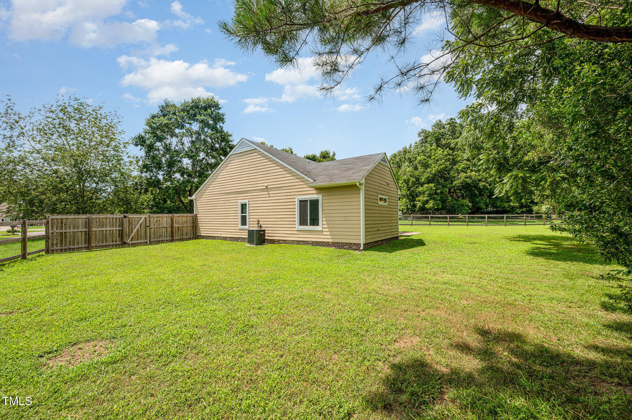 6 Blake Court Durham, NC 27712 - Photo 16 of 19 a view of a backyard with a garden