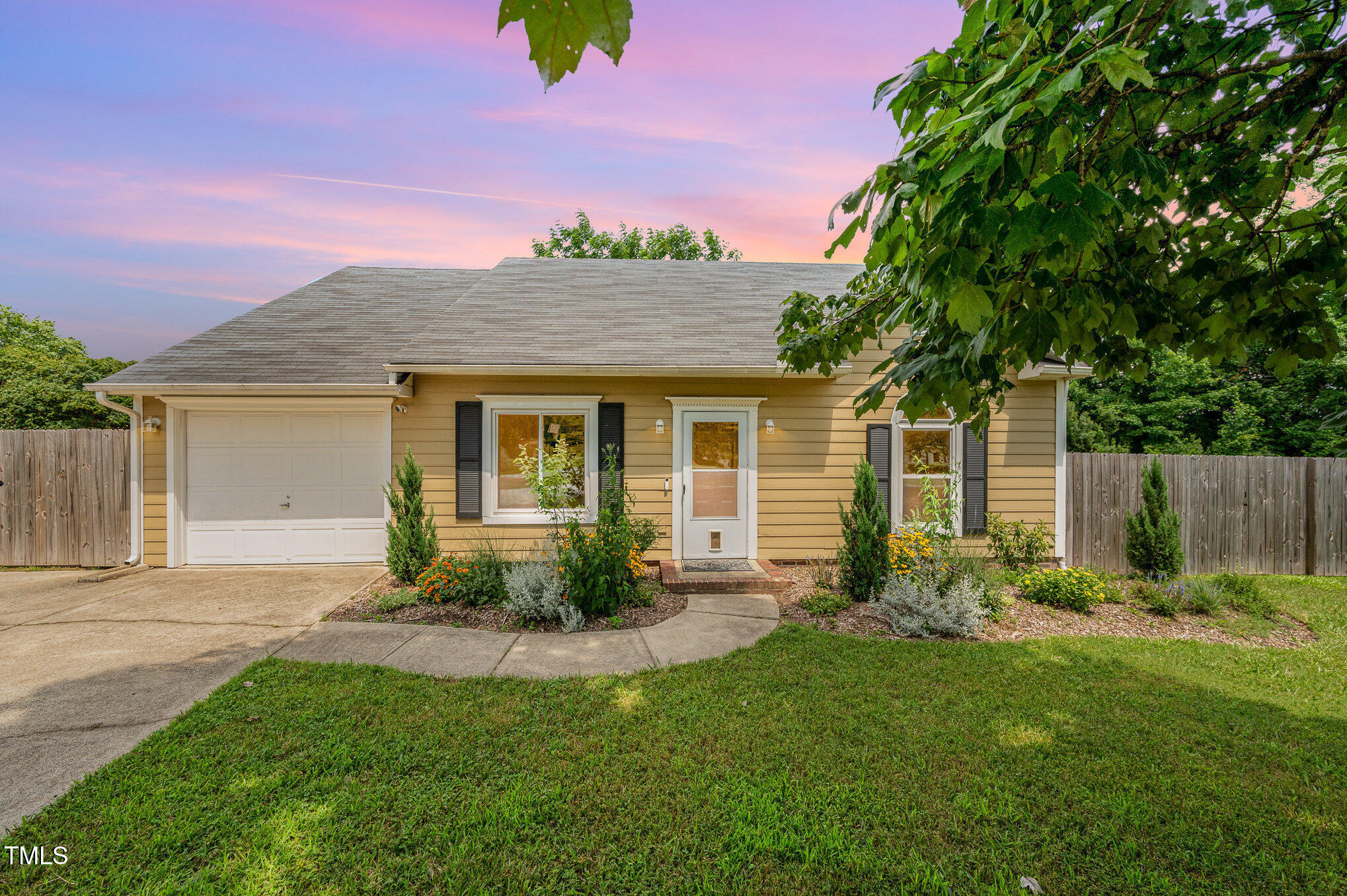 6 Blake Court Durham, NC 27712 - Photo 18 of 19 a front view of a house with garden