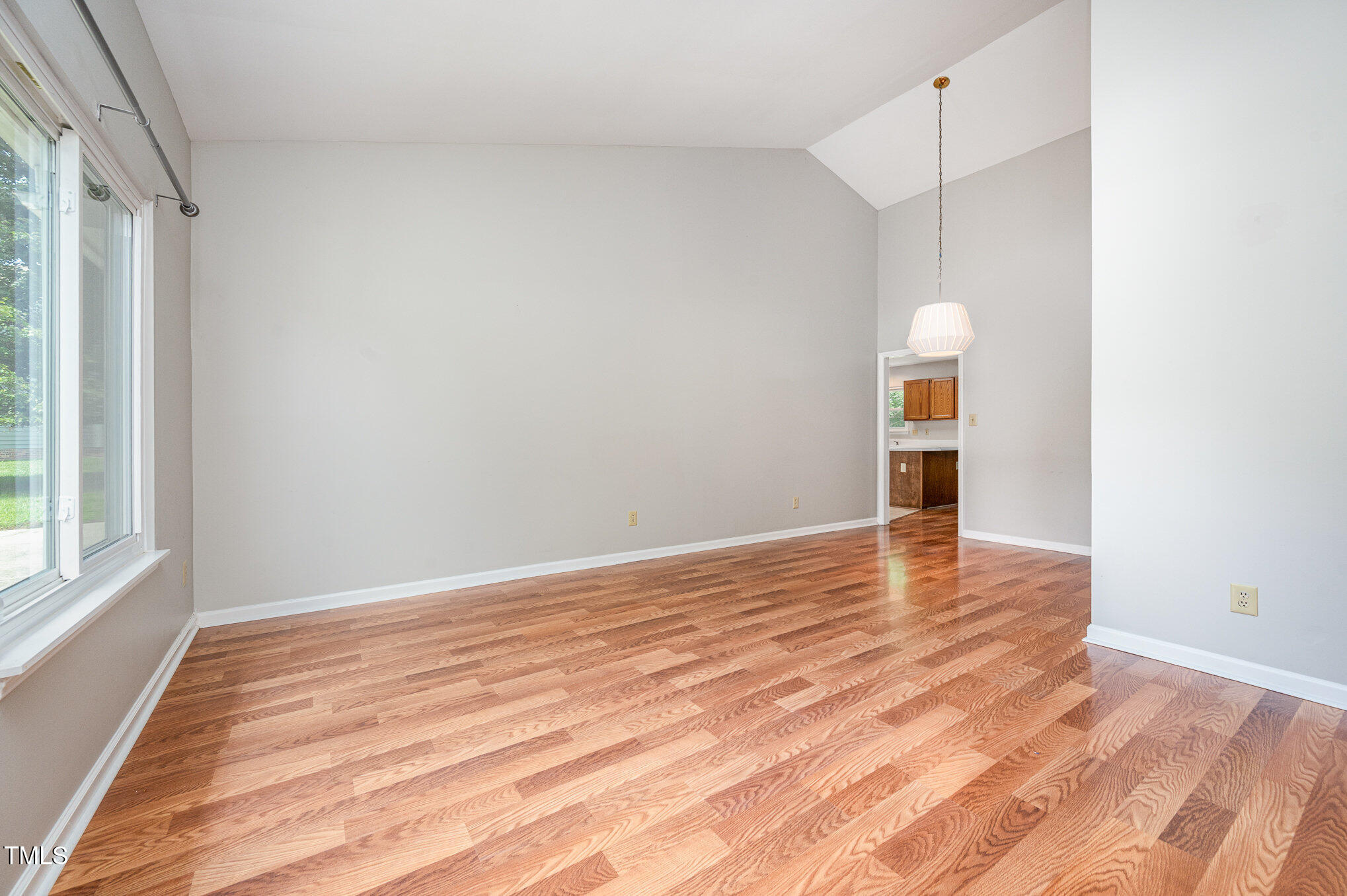 6 Blake Court Durham, NC 27712 - Photo 3 of 19 a view of empty room with wooden floor and fan