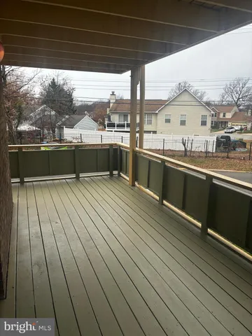 a view of a balcony with wooden floor