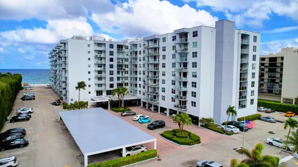 a view of a patio with plants and furniture