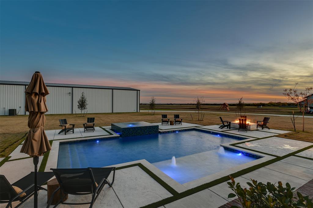 470 Forreston Road Waxahachie, TX 75165 - Photo 13 of 38 Outdoor pool featuring an outdoor fire pit, an outdoor structure, a pole building, an in ground hot tub, and a patio