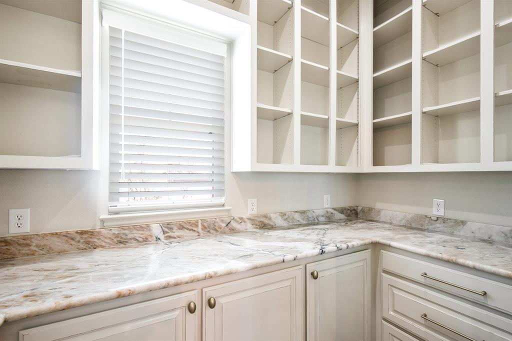 470 Forreston Road Waxahachie, TX 75165 - Photo 15 of 38 Kitchen with white cabinets and glass insert cabinets