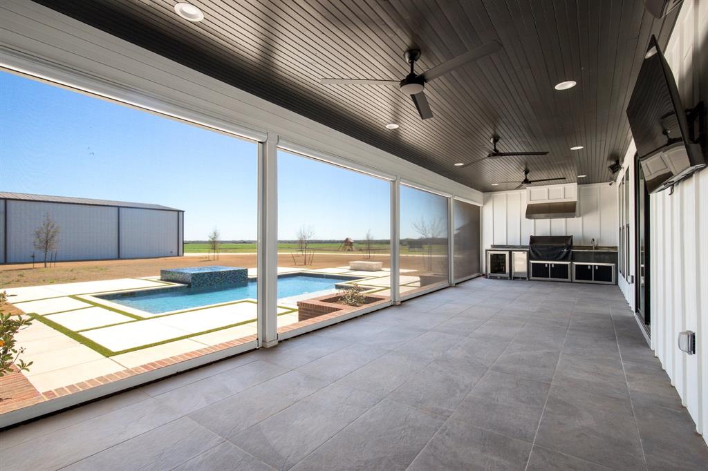 470 Forreston Road Waxahachie, TX 75165 - Photo 17 of 38 Unfurnished sunroom with a hot tub