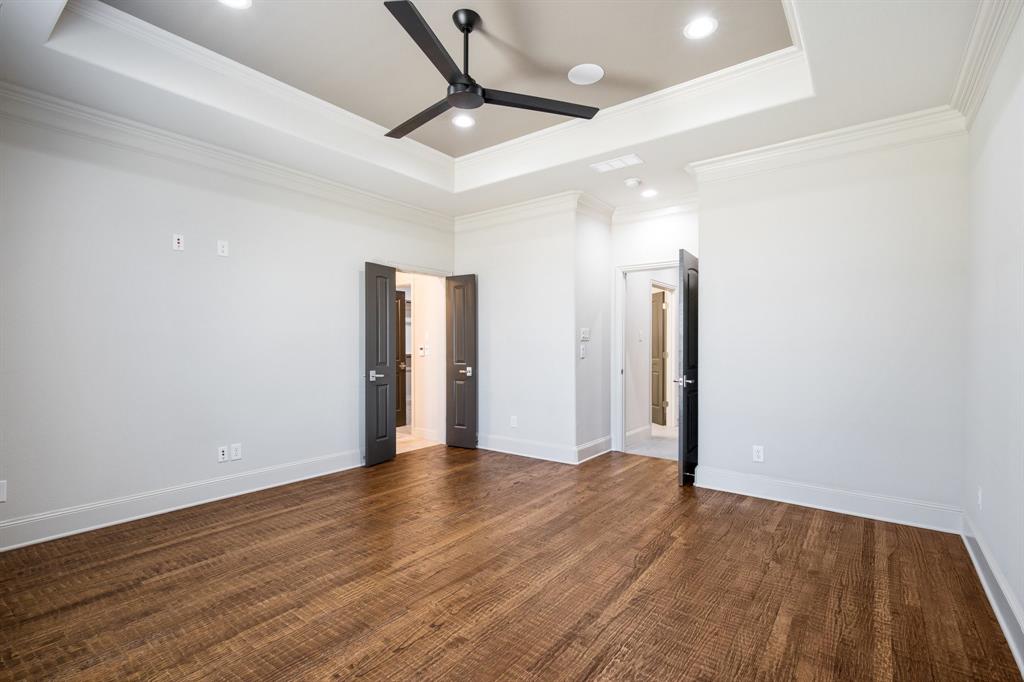 470 Forreston Road Waxahachie, TX 75165 - Photo 27 of 38 Unfurnished bedroom with a tray ceiling and baseboards