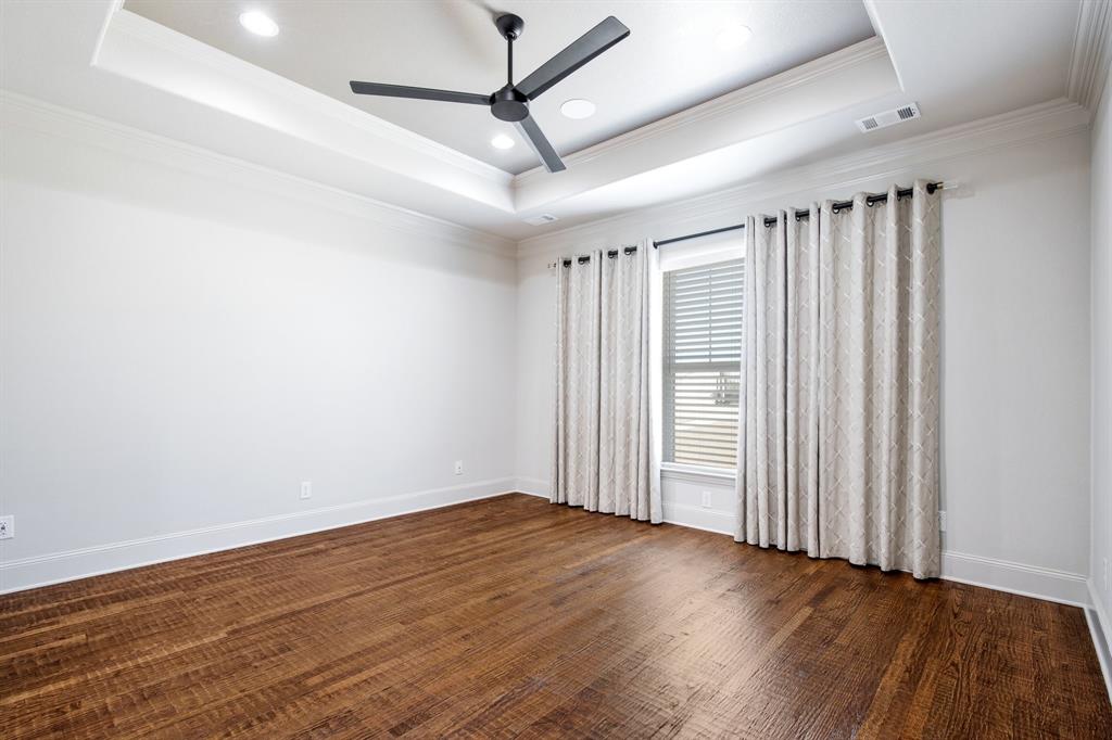 470 Forreston Road Waxahachie, TX 75165 - Photo 28 of 38 Empty room with a tray ceiling, crown molding, baseboards, and ceiling fan