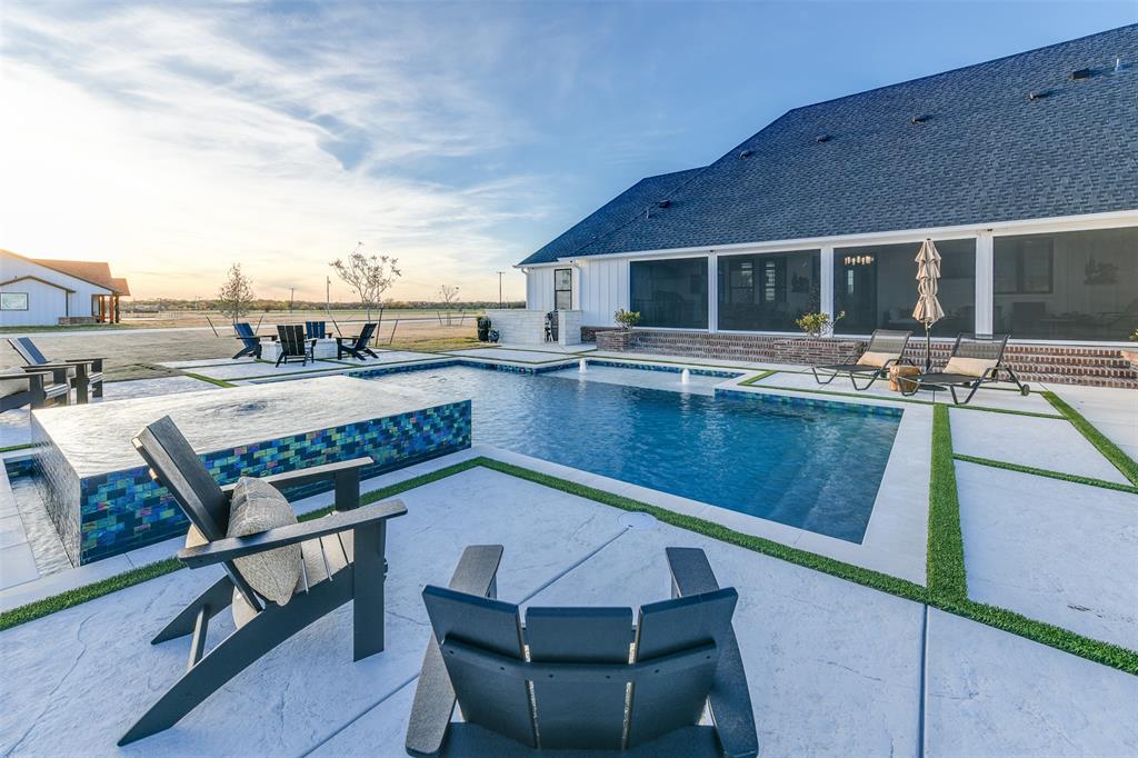 470 Forreston Road Waxahachie, TX 75165 - Photo 9 of 38 Pool at dusk with fence, a patio area, and an outdoor pool